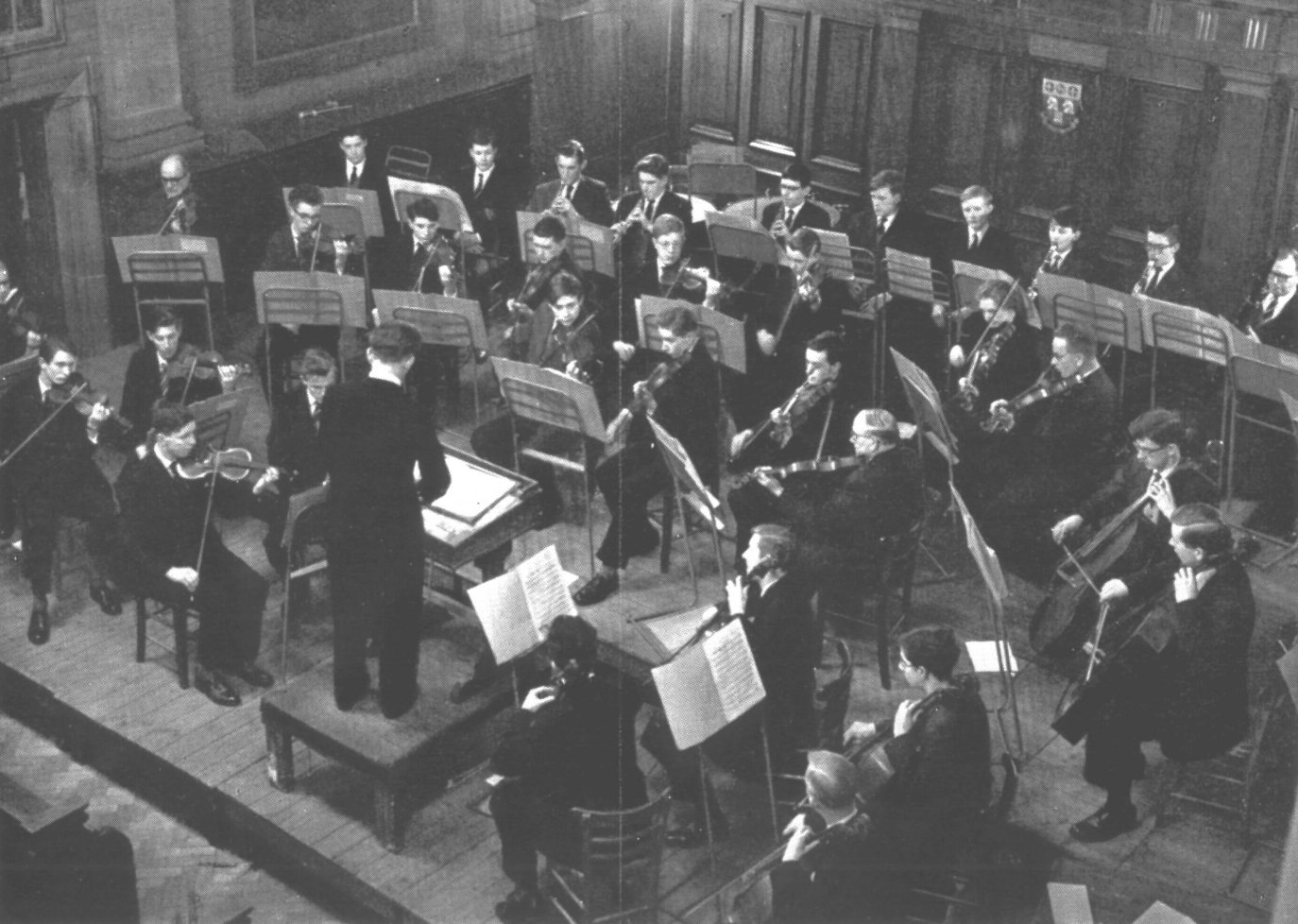 The RGS First Orchestra around 1961 conducted by Jack Wolstenholme, lead by Tom Banfield